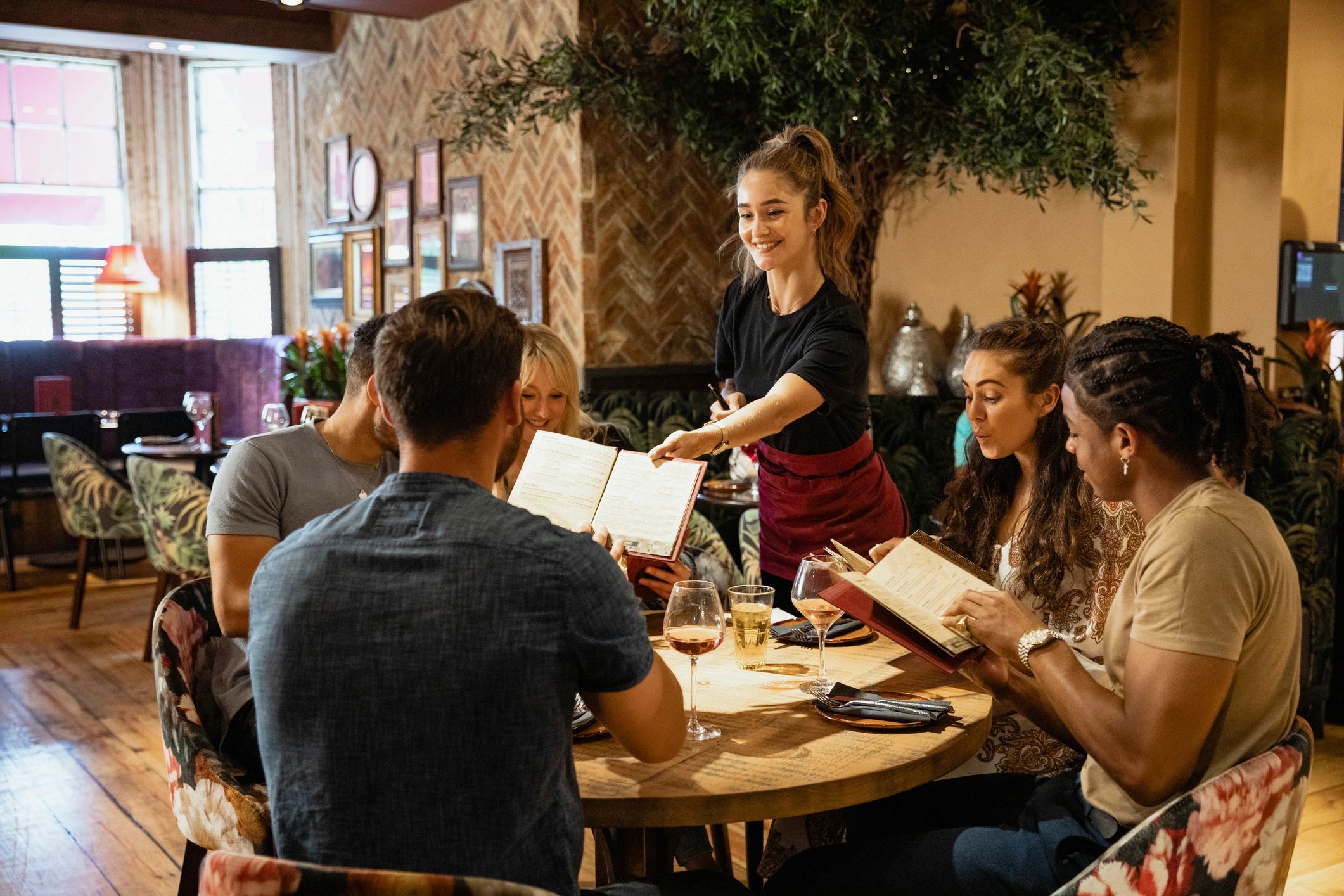 Friends gathered for a birthday dinner at a restaurant